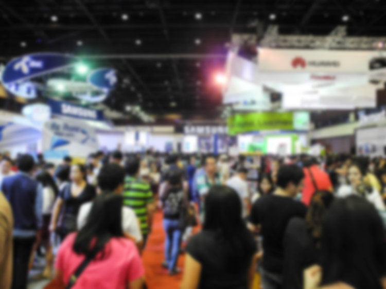 Abstract people walking in exhibition blurred background